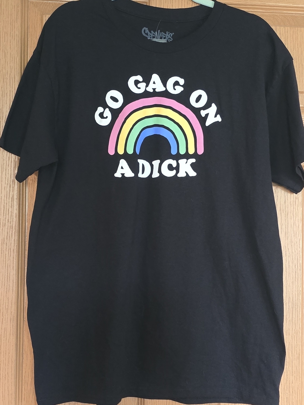 Spencer's Black Tee with Rainbow Graphic and White Lettering